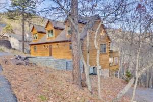 a large wooden house on top of a hill at Big Bear Lodge - Cabin in Massanutten Resort! in McGaheysville