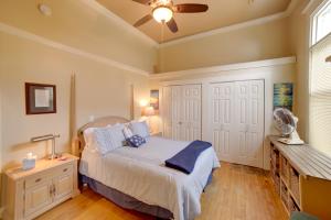 a bedroom with a bed and a ceiling fan at Updated Apt 1 Block to Water St and Kalamazoo River in Saugatuck