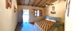 Cama ou camas em um quarto em MANGO LODGE