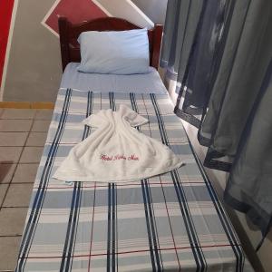 Ein Bett oder Betten in einem Zimmer der Unterkunft Hotel Beira Mar