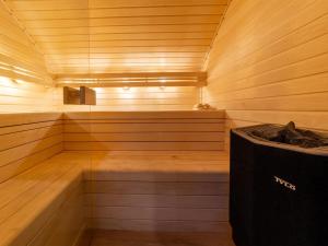 a sauna with a bench and a trash can at Charming holiday home in Durbuy with garden in Durbuy