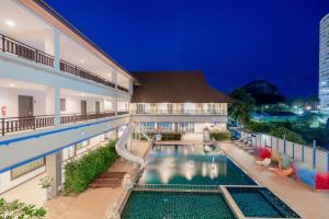 a swimming pool in the middle of a building at Napalai Resort & Spa in Hua Hin