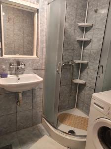 a bathroom with a shower and a sink at Family-friendly apartments with swimming pool Rtina - Stosici, Zadar - 21450 in Rtina +20 photos