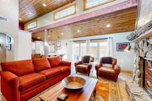 a living room with a couch and two chairs at Flagstaff Fantasy - Entire Property in Flagstaff