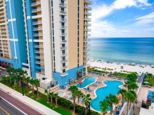 an aerial view of a resort with a pool and the ocean at Majestic Resort! Newly Updated Beachfront 3BR Condo in Panama City Beach