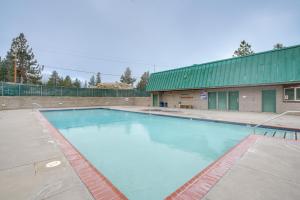 a large swimming pool in front of a building at Stateline Townhome Less Than 1 Mi to Heavenly Ski Lifts in Stateline