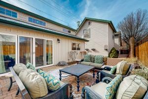 a patio with couches and a table in front of a house at Flagstaff Fantasy - Casita in Flagstaff