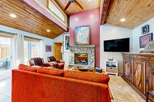 a living room with a couch and a fireplace at Flagstaff Fantasy - Casita in Flagstaff