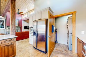 a kitchen with a refrigerator and a counter at Flagstaff Fantasy - Casita in Flagstaff +10 photos