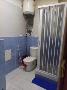 a bathroom with a toilet and a shower stall at L’oranais in Oran