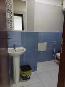 a bathroom with a sink and a mirror at L’oranais in Oran