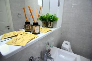 a bathroom counter with a sink and a mirror at Urban Oasis 216 in Almaty