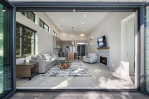 a living room with a couch and a fireplace at Beachfront Luxury Suite #21 at THE BEACH HOUSE in Campbell River