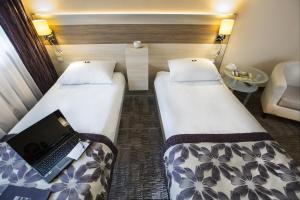 Posteľ alebo postele v izbe v ubytovaní Comfort by Trio