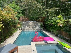 a pool with a plastic rubber duck in the water at Superb Beach Home:Heated Pool-Hot Tub Open 365Days in Toronto