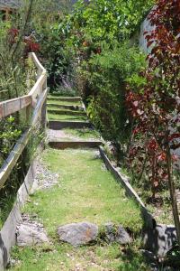 a set of stone stairs in a garden at Spirit Of The River Lodge in Cusco