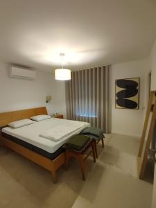 Katil atau katil-katil dalam bilik di Superacao Ferragudo Flat River View +7 gambar