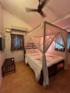 Postel nebo postele na pokoji v ubytování Ocean View Goan Beach House