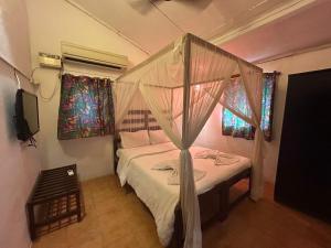 Postel nebo postele na pokoji v ubytování Ocean View Goan Beach House