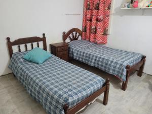 A bed or beds in a room at departamento en barrio Roca