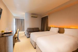 Katil atau katil-katil dalam bilik di Sukhothai Hotel and Residence