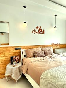 Postel nebo postele na pokoji v ubytování มีใจ พูลวิว เกาะล้าน MeeJai Pool View Kohlarn + 18 fotografií