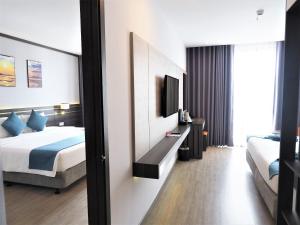 Postel nebo postele na pokoji v ubytování Seana Hotel