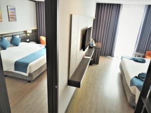 Postel nebo postele na pokoji v ubytování Seana Hotel