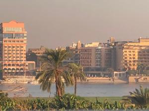 a view of a city with a river and buildings at Djorf apartments in Al Aqālitah