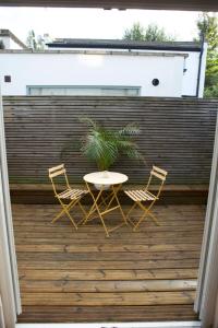 a patio with a table and two chairs and a plant at Inviting & Secluded 1BD House w Patio - Peckham! in London