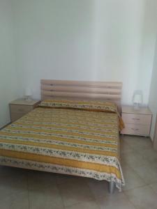 Postel nebo postele na pokoji v ubytování Camping Cala dei Ginepri