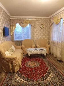 a living room with a couch and a coffee table at Family house in Sevan