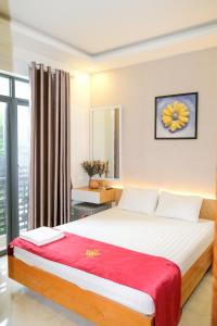 Postel nebo postele na pokoji v ubytování Lộc Thiên Ân hotel