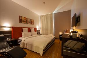 Postel nebo postele na pokoji v ubytování Euro Hotel Residence