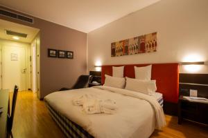 Postel nebo postele na pokoji v ubytování Euro Hotel Residence