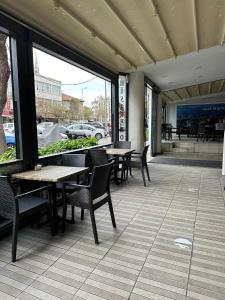 a patio with tables and chairs in a restaurant at HİSAR HOTEL in Istanbul