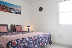 a bedroom with a bed and a window at Playa Troya In front of Beach, Very quiet in Playa de las Americas