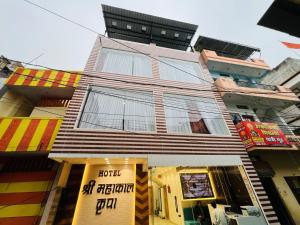 a building with a sign on the front of it at Hotel shree mahakal krapa in Ujjain +19 photos