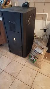 a computer sitting on the floor next to a box at CASA MEA-Casa Mocanu in Giurgiu +126 photos