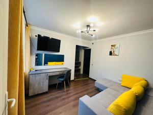 a living room with a couch and a desk at VELI HOUSE VELINGRAD/ ВелиХаус Къща за гости Велинград in Velingrad +25 photos