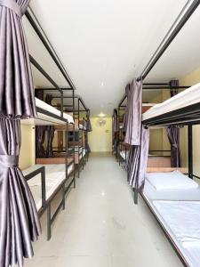 a group of bunk beds in a dorm room at Hangover Aonang in Ao Nang Beach