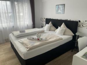Postel nebo postele na pokoji v ubytování Hotel Friesengeist