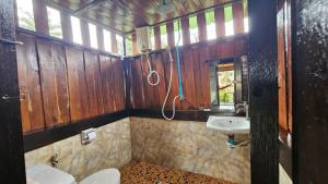 a bathroom with a toilet and a sink at Eden Lanta Bungalow in Phra Ae beach