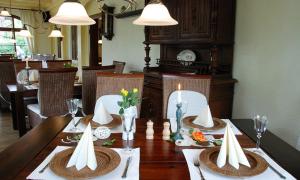 a dining room table with a table set for a meal at Weißer Stein Jonsdorf in Kurort Jonsdorf