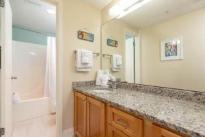 a bathroom with a sink and a shower at Phoenix X 317 in Orange Beach +45 photos