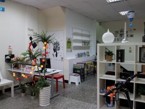 a room with white shelves and plants in it at Jia Mei Fa Homestay in Taitung City
