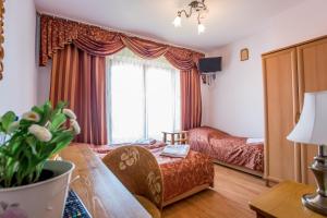 Postel nebo postele na pokoji v ubytování Pod Modrzewiami