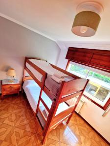 a bedroom with a bunk bed and a window at Casa Antonio Luneda in Parada de Achas