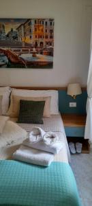 Ένα ή περισσότερα κρεβάτια σε δωμάτιο στο Hotel Castelfidardo