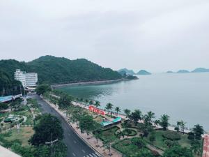 a view of a street next to a body of water at Cat Ba Central Sea View - Hoang Ngoc Hotel in Cat Ba